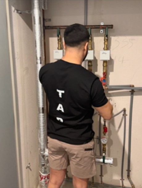 Water meters and isolation valves in a riser cupboard